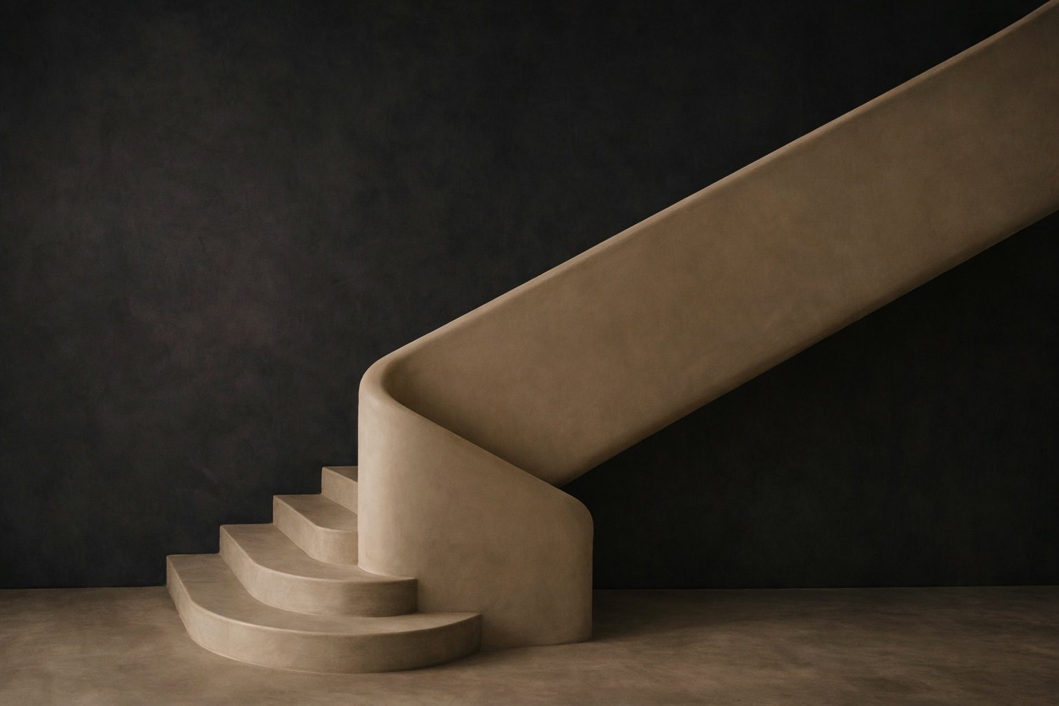 A staircase finished in Cemtara microcement against a graphite wall in a private residence.
